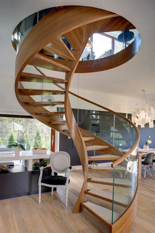 curved wooden glass staircase