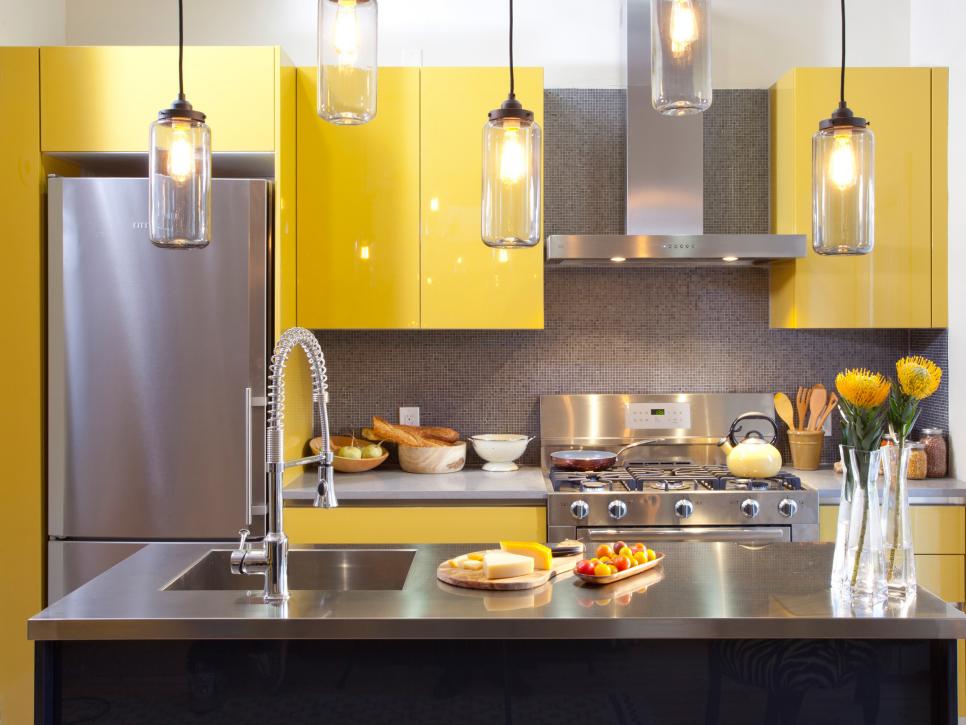 highglass yellow kitchen with steel backsplash luxazin